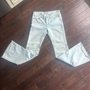 Free people pale blue, low rise, frayed, flare jeans. Size 28.